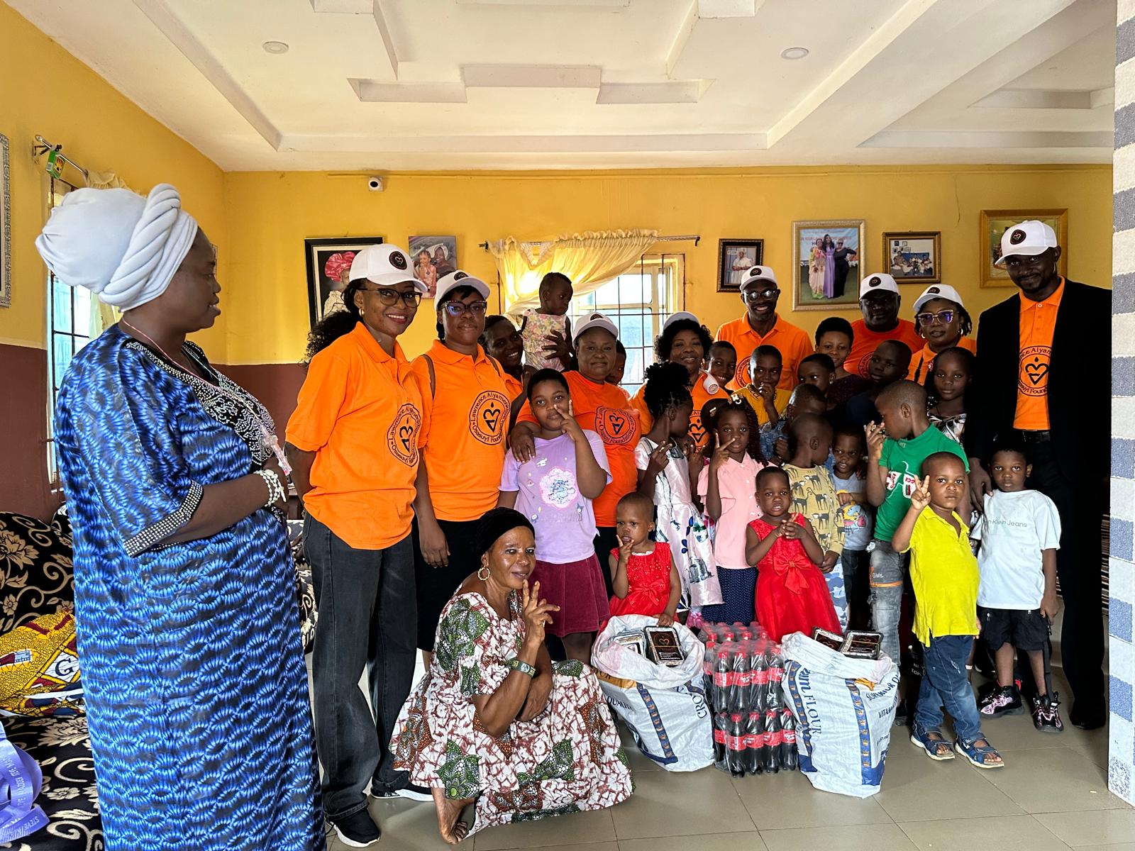 LAOF volunteers with children and adults in a community hall