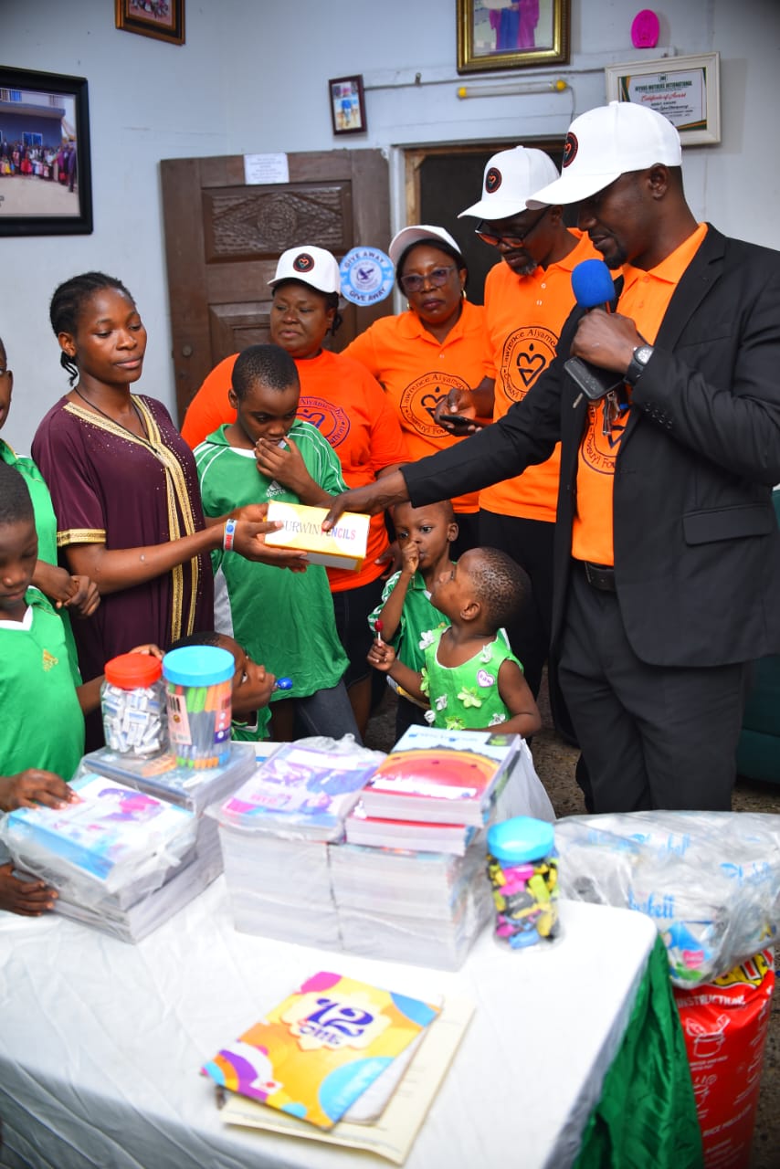 A LAOF representative presenting supplies to a community host