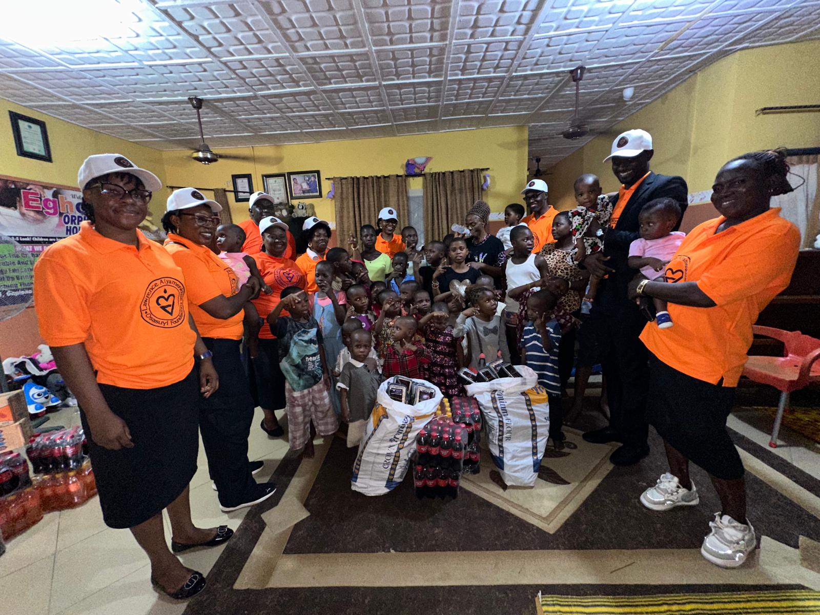 LAOF volunteers addressing a community gathering with donated supplies