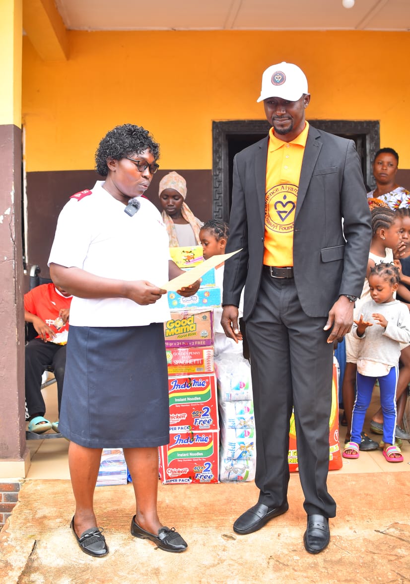 LAOF representatives handing over a document at a community visit