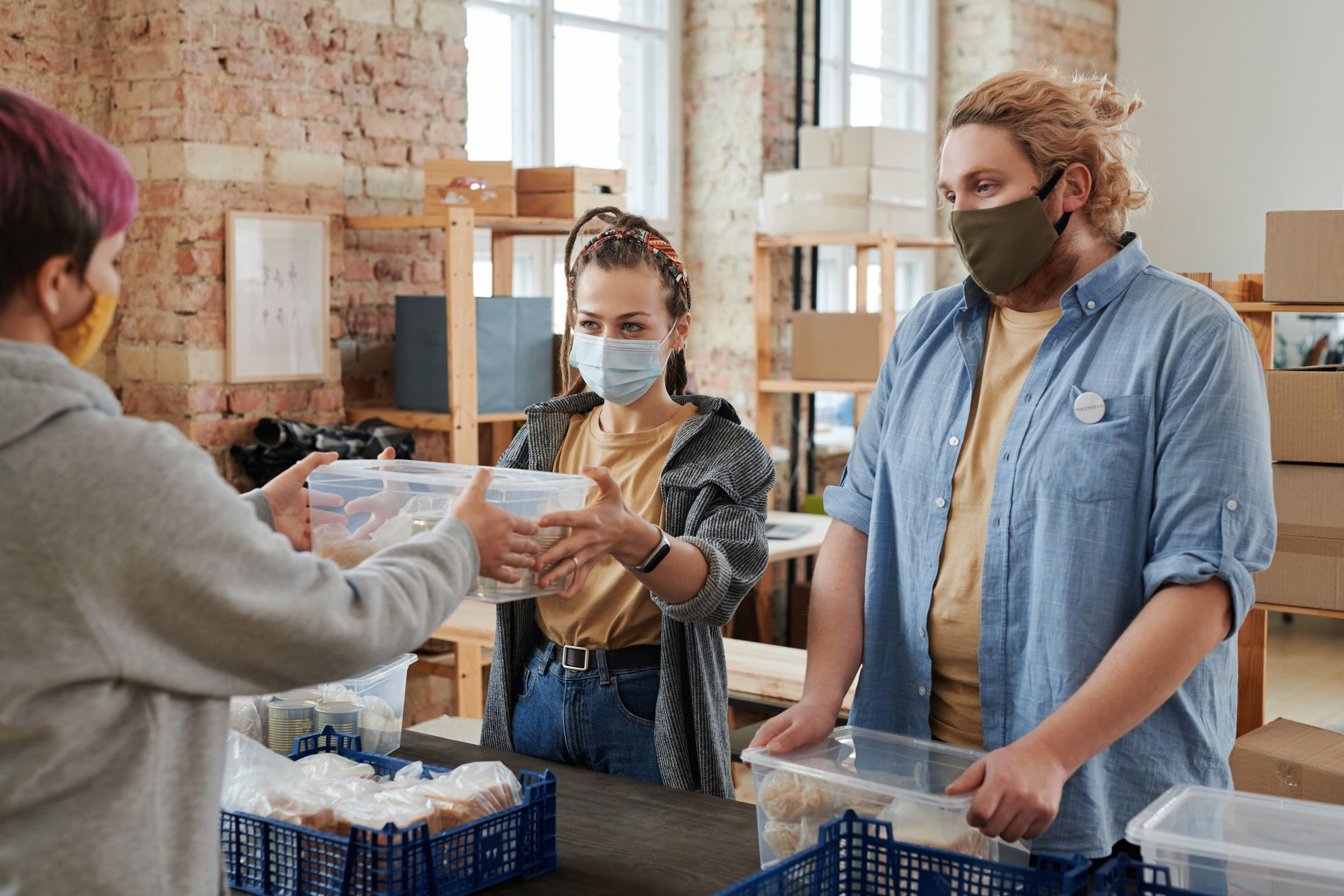 Illustrative photo: Volunteers handing out food at a donation centre