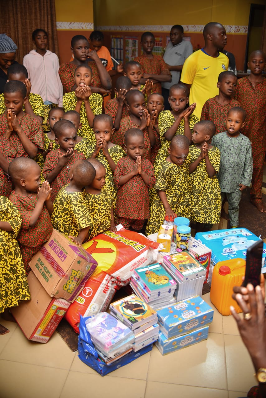 A community gathering with children and donated essentials