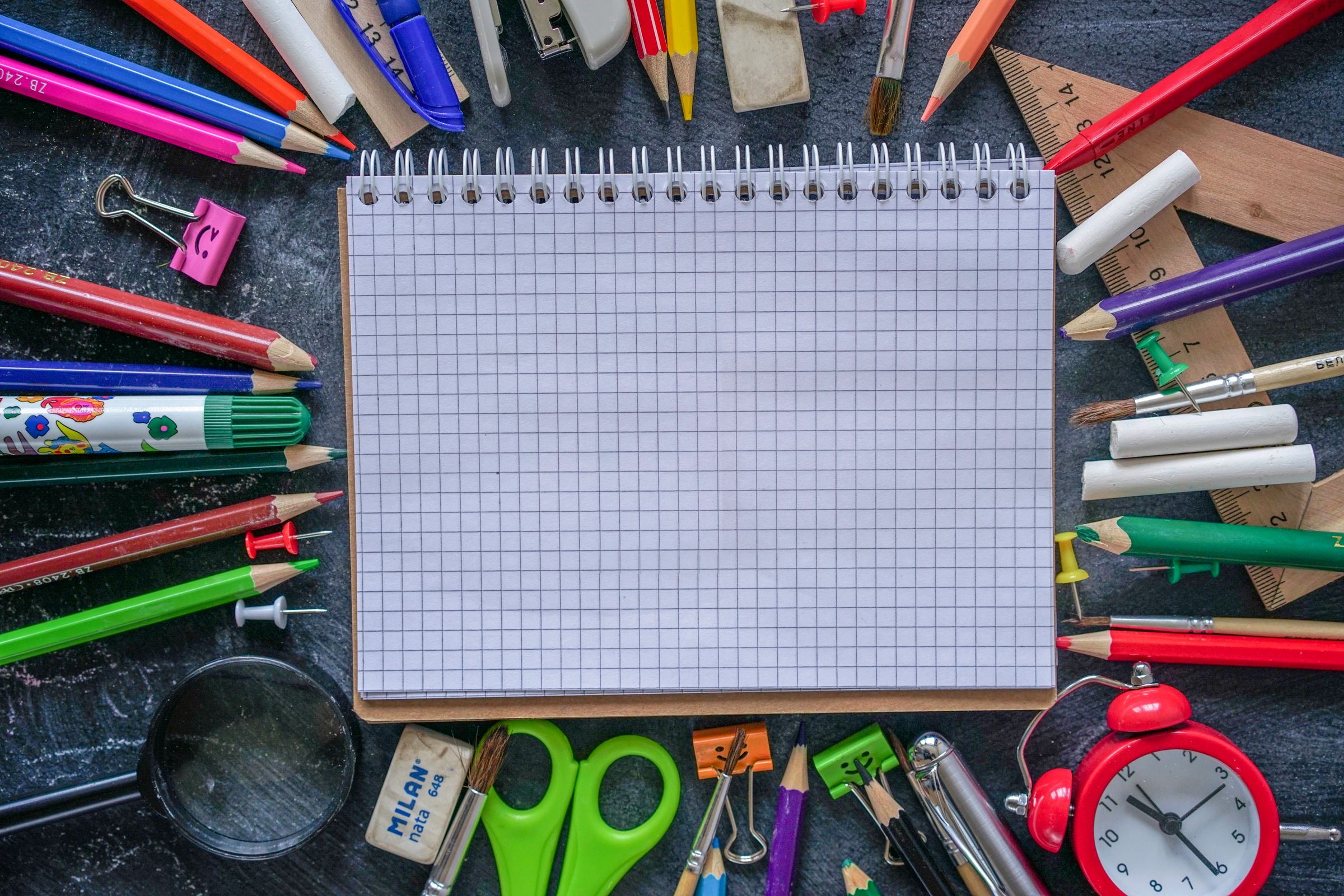 Illustrative photo: Notebooks, pencils and colourful learning supplies