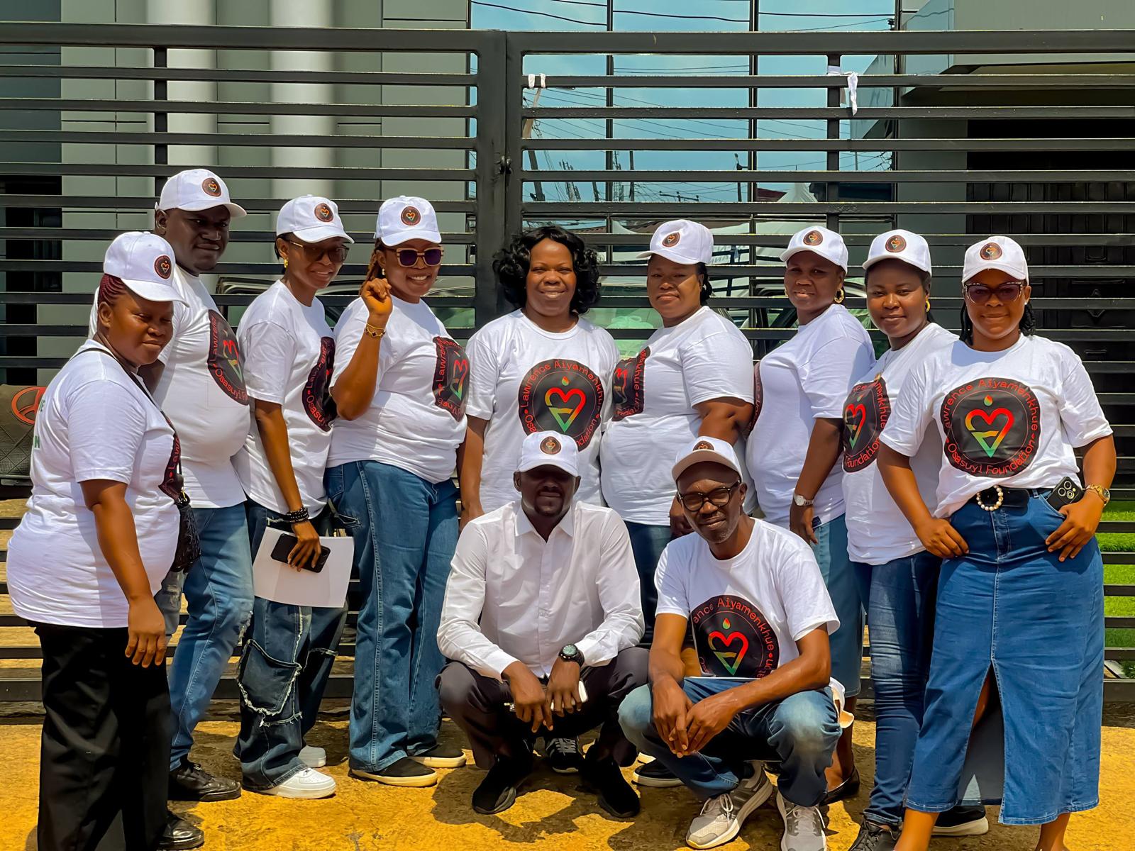 LAOF volunteers in white shirts gathered outdoors