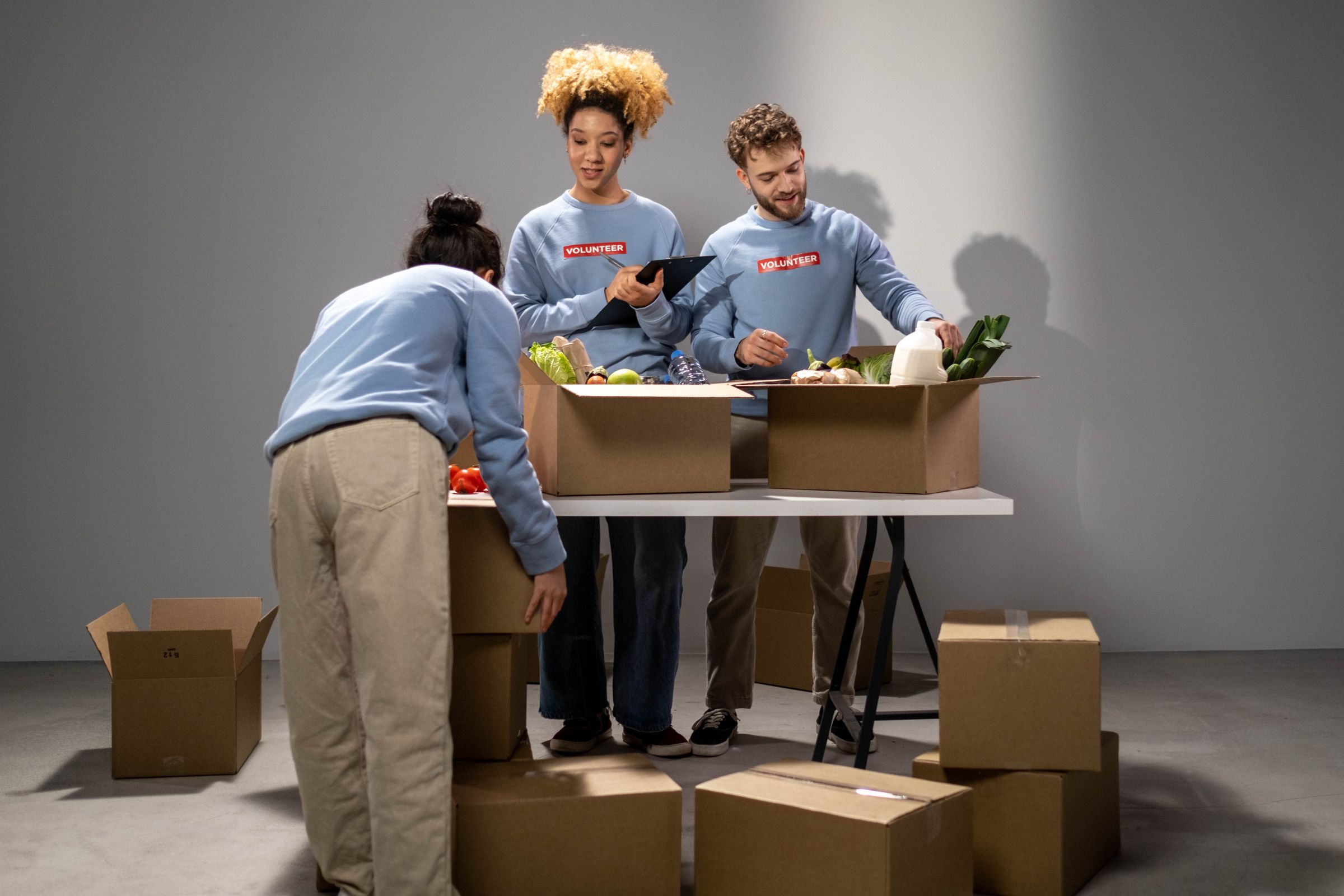 Illustrative photo: Volunteers packing food into donation boxes