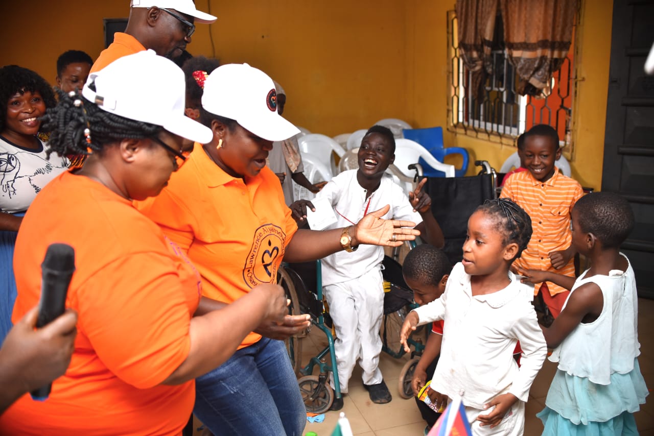 LAOF volunteers welcoming children and caregivers during an outreach visit