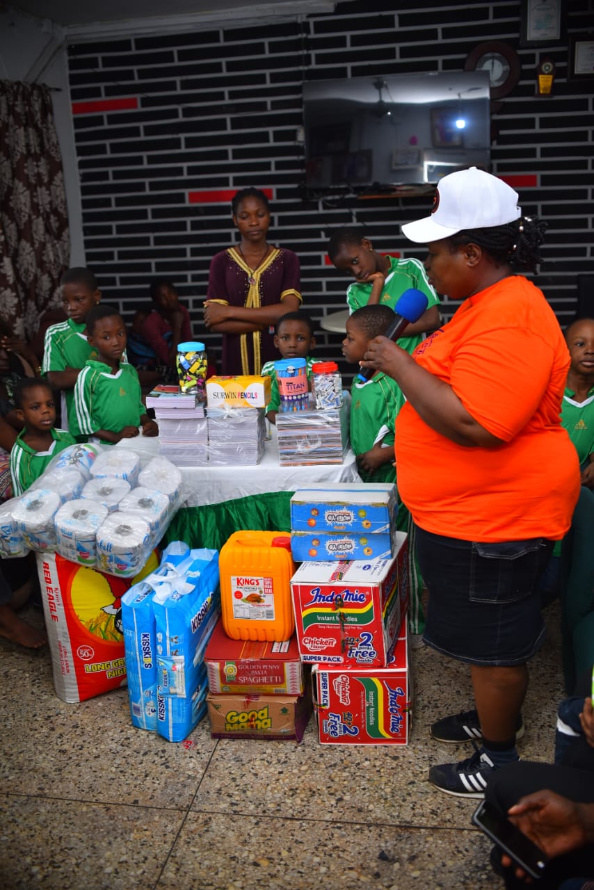 A LAOF volunteer speaking with children at a community gathering