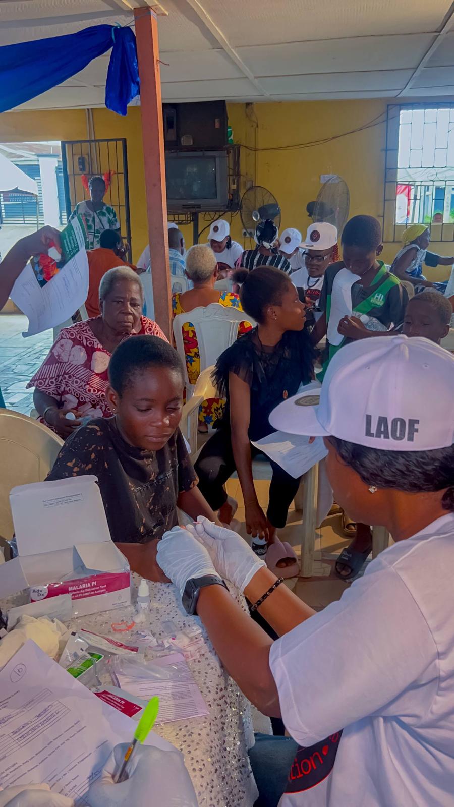 A volunteer taking part in an indoor outreach gathering