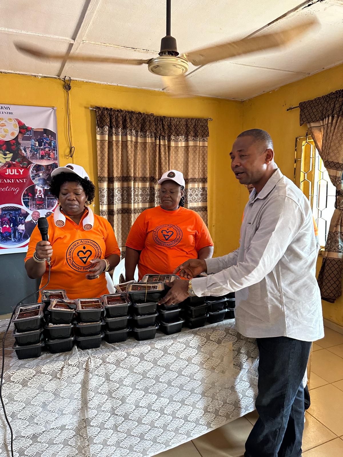 A community representative receiving supplies from the LAOF team