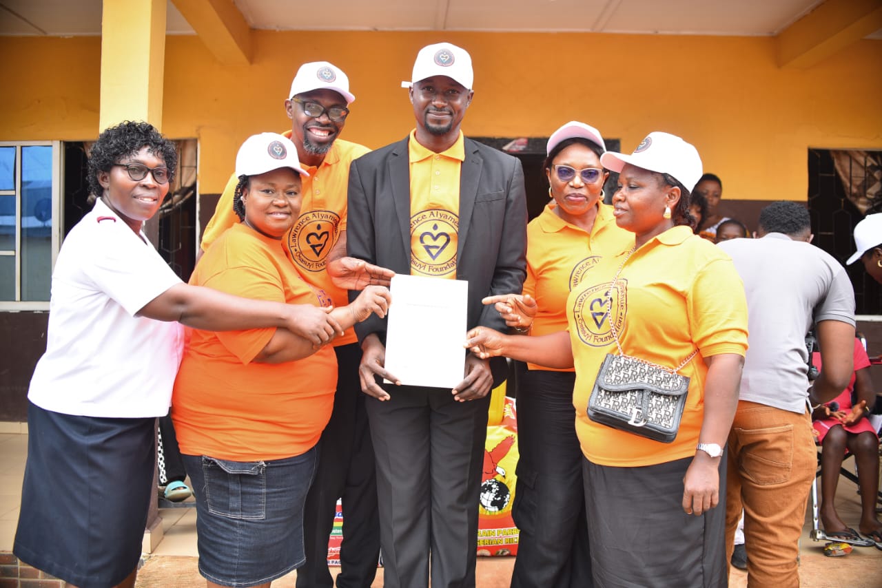 LAOF volunteers presenting a document together during outreach