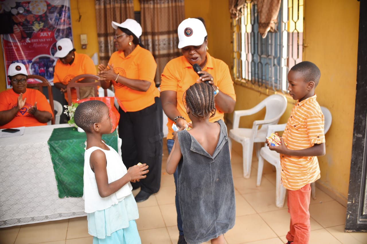 LAOF volunteers welcoming children during a community visit