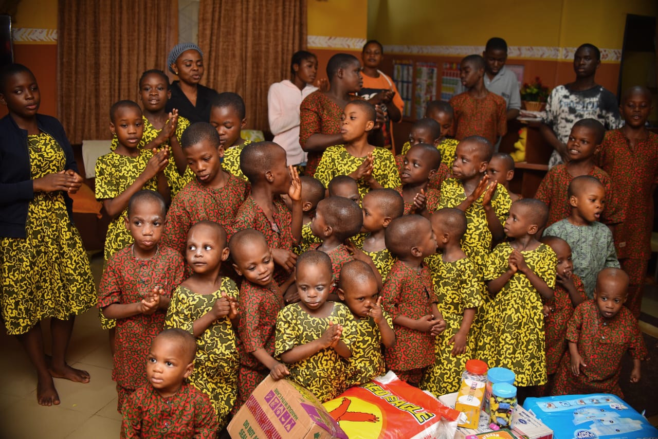 Children and adults together at a LAOF community visit