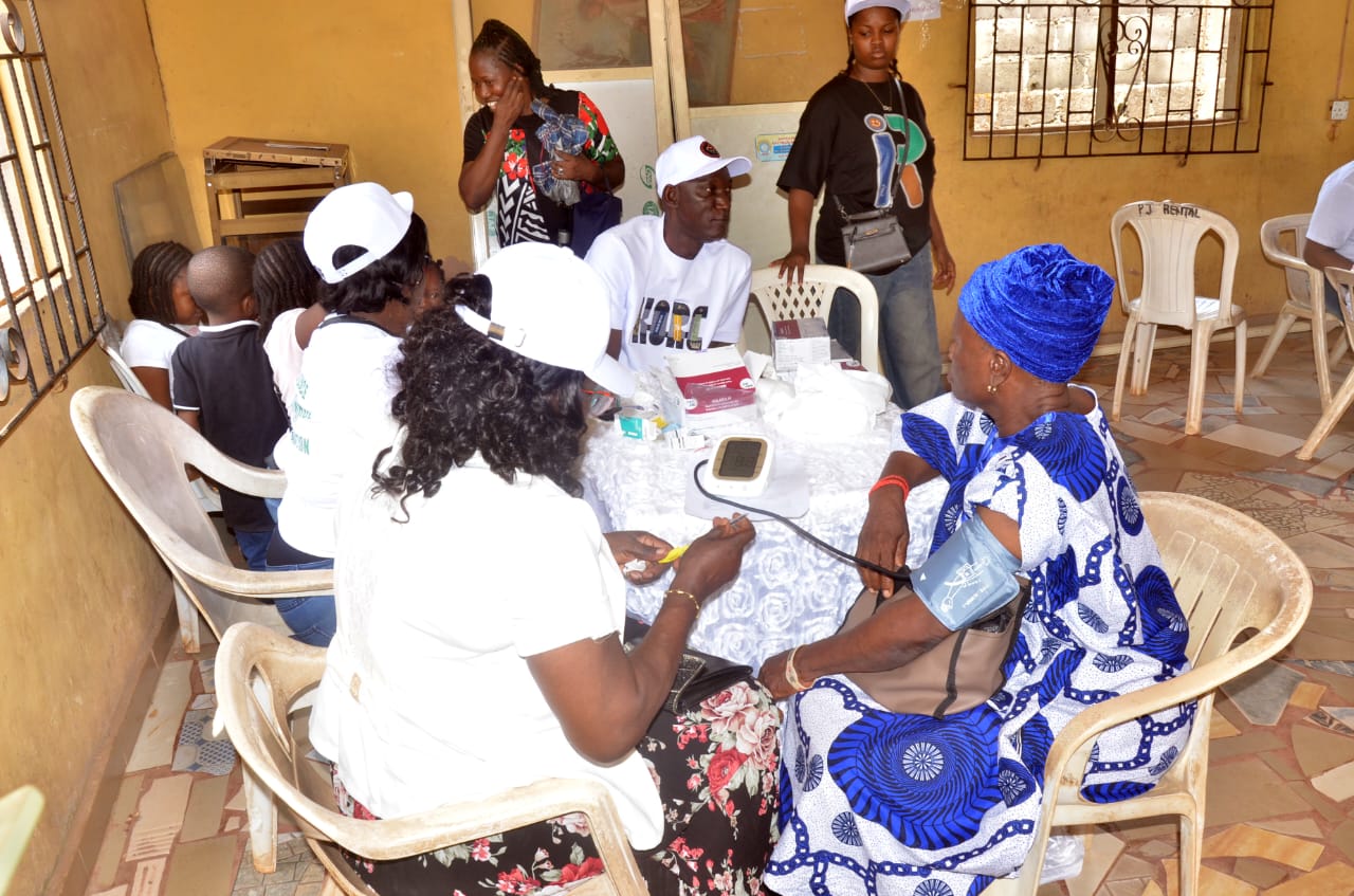 LAOF volunteers attending to people in a community hall