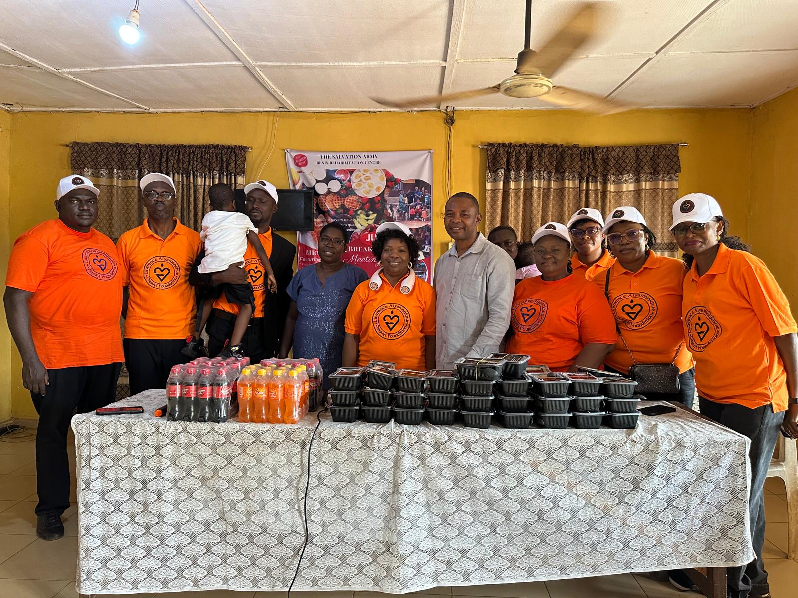 LAOF volunteers behind a table of packed meals and drinks