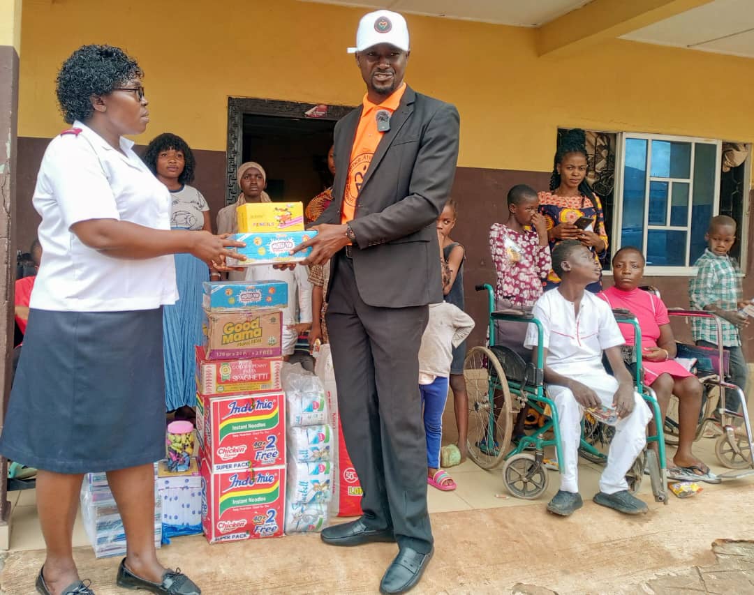 LAOF representatives presenting supplies during a community visit