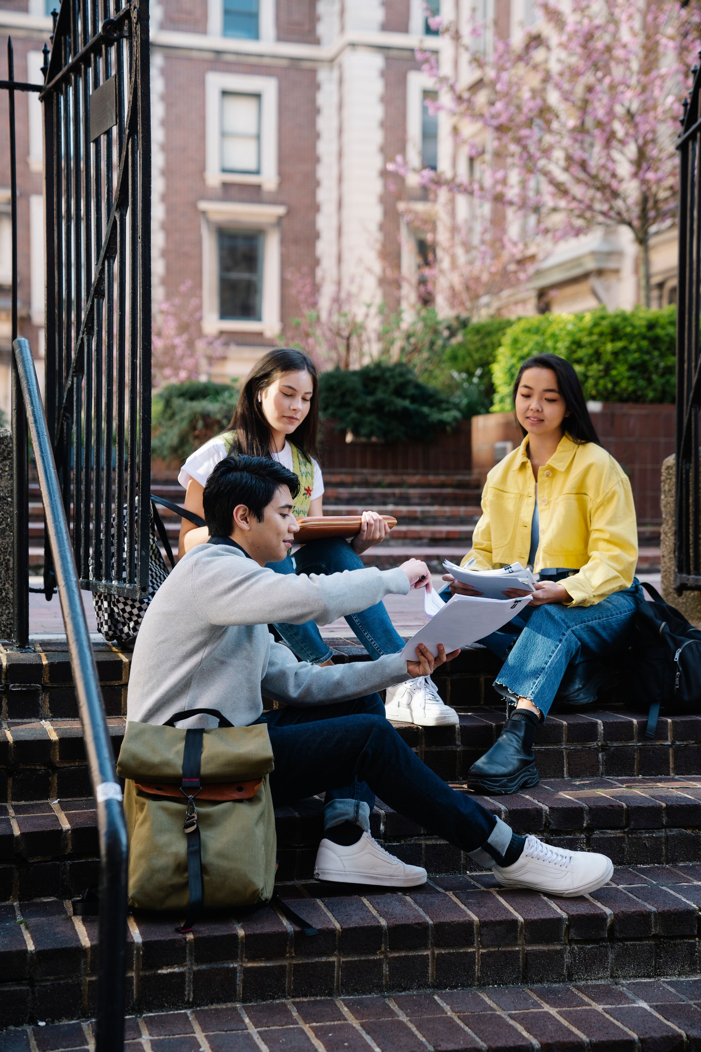 Illustrative photo: University students discussing their studies on outdoor steps