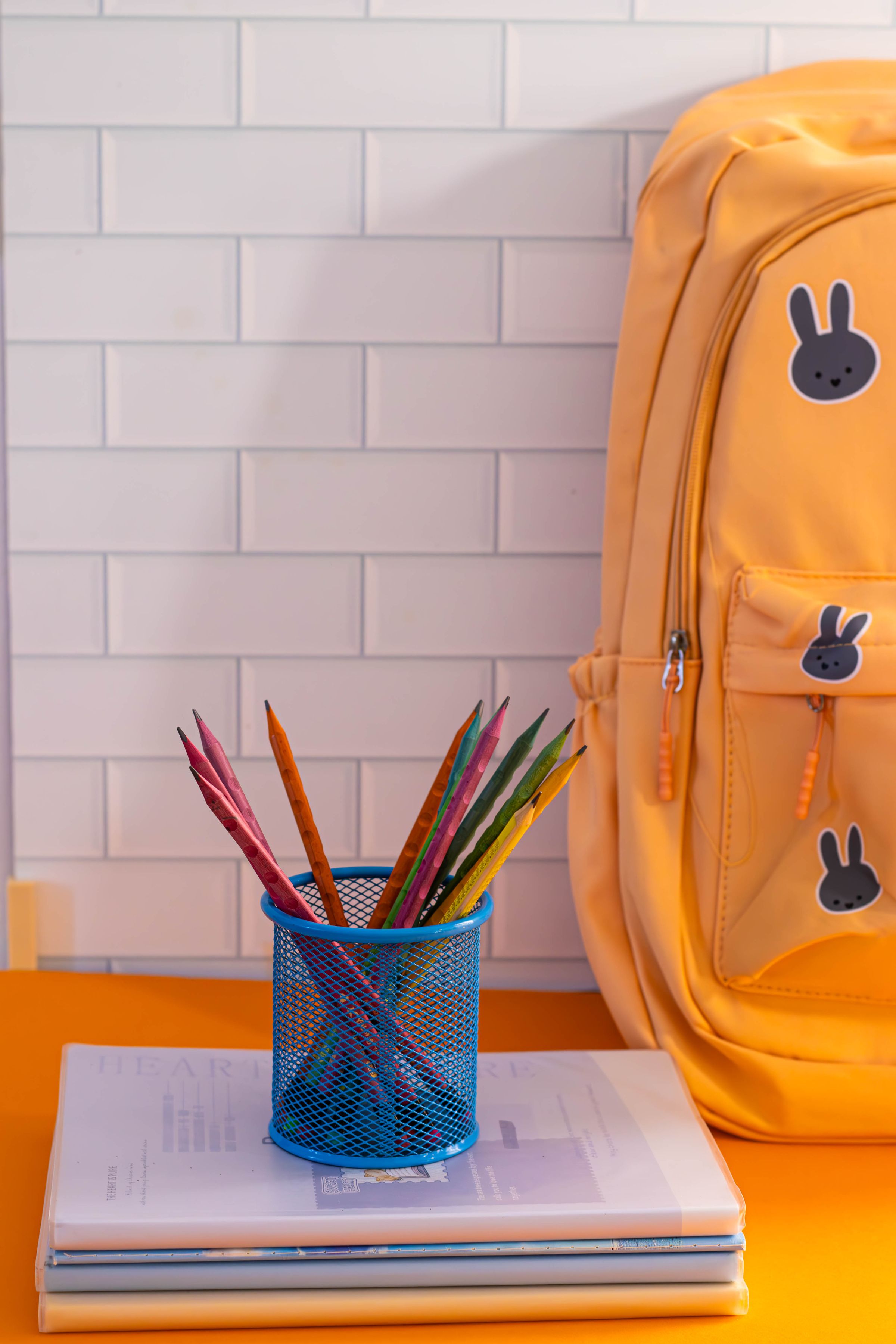 Illustrative photo: A backpack, pencils and stationery arranged on a school desk